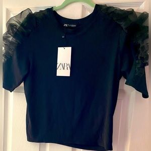 Black blouse by Zara.